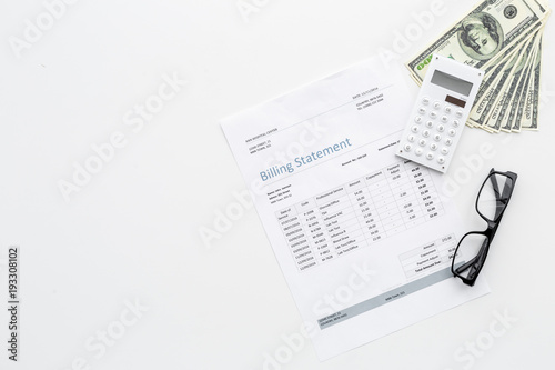 Pay bills and taxes. Billing statement, calculator, money on white background top view copy space © 9dreamstudio