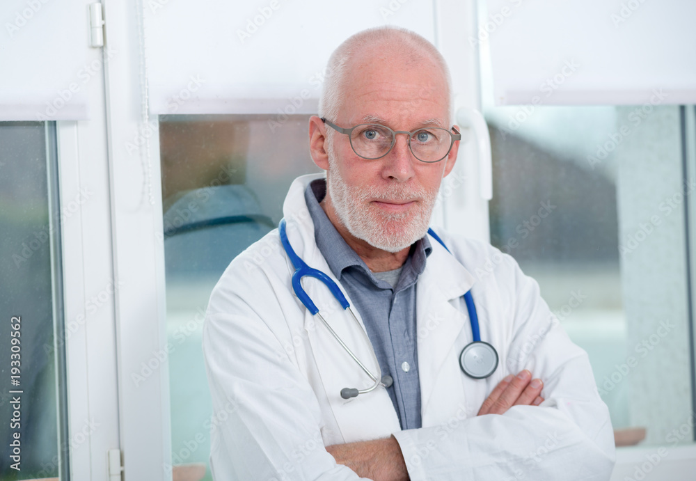 portrait of mature medical doctor with stethoscope portrait of mature medical doctor with stethoscope