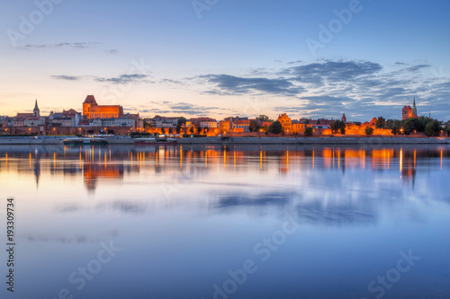 Torun old town over Vistula river at sunset, Poland