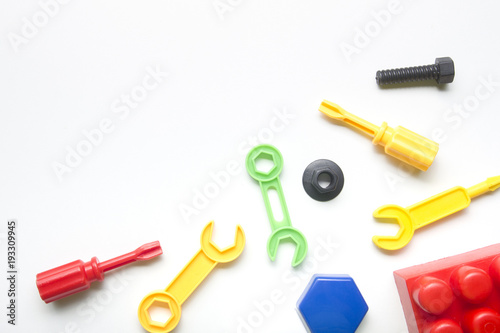 Kids educational developing toys frame on white background. Top view. Flat lay. Copy space for text