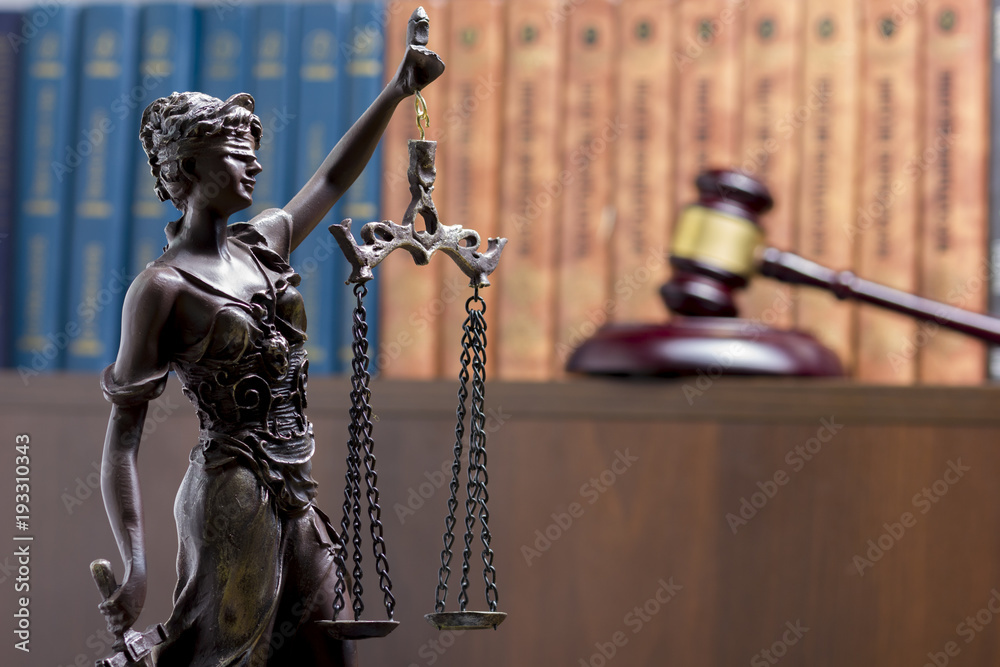 Legal Law concept - Open law book with a wooden judges gavel on table in a courtroom or law enforcement office. Copy space for text Legal Law concept - Open law book with a wooden judges gavel on table in a courtroom or law enforcement office. Copy space for text