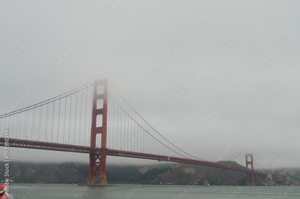 Fototapeta premium Wonderful Views Of The San Francisco Bridge In A Day With Low Clouds. Travel Holidays Architecture June 30, 2017. San Francisco. California EEUU USA.