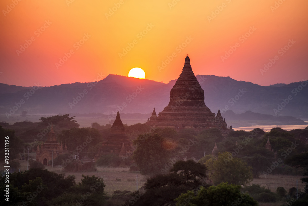 beautiful landscape view of sunrise and fog over ancient pagoda in Bagan , Myanmar