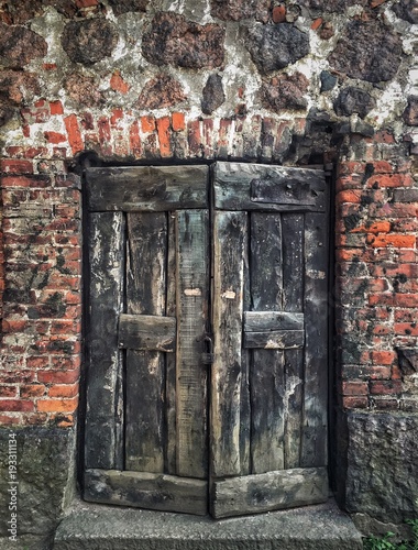 Rustic door in ancient fortress in Vyborg, Russia