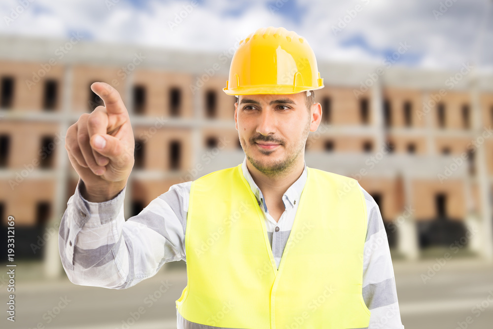 Confident architect or engineer touching invisible screen with index finger. Confident architect or engineer touching invisible screen with index finger.