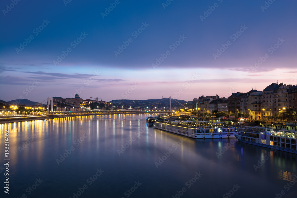 Danube river at dusk, distant Castle Hill view, Budapest