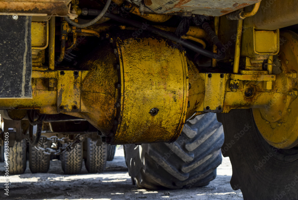 Wheel axle of the tractor. Tractor, standing in a row. Agricultural machinery. Parking of agricultural machinery Wheel axle of the tractor. Tractor, standing in a row. Agricultural machinery. Parking of agricultural machinery