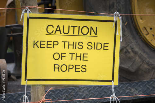 Caution Keep this side of the ropes sign