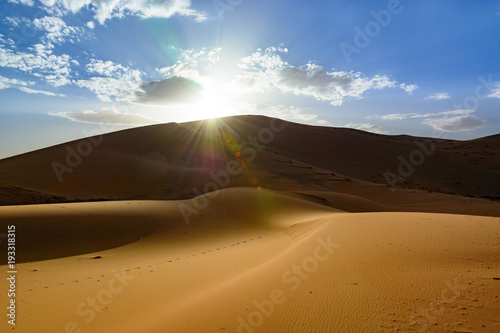 sunset in the Sahara desert, Erg Chebi dunes. Merzouga, Morocco