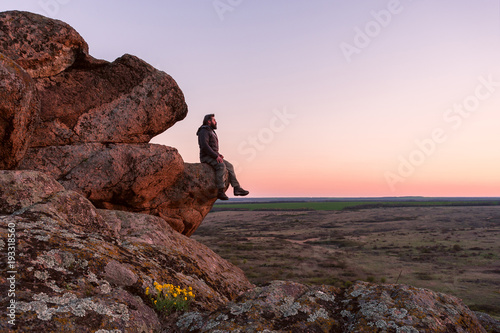Traveler Stand on a Mountain Top photo