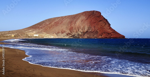 Beautiful coastal view of Playa de la Tejita with Montana Roja (Red Mountain).La Tejita beach in El Medano,Tenerife,Canary Islands,Spain. photo