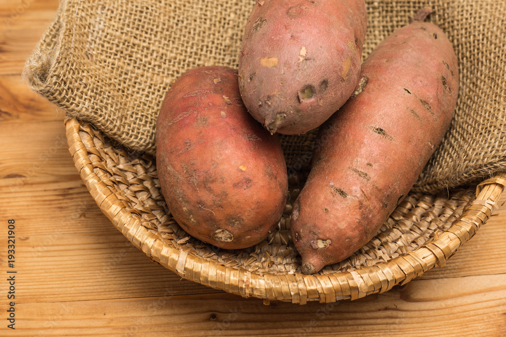 sweet potato potatoes food vegetable and old wooden board sweet potato potatoes food vegetable and old wooden board