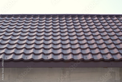 Modern roof covered with tile effect PVC coated metal roof sheets 