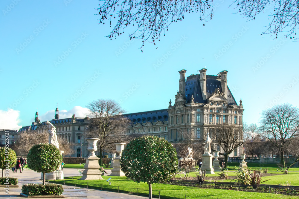 Fototapeta premium View of the rught aisle of the Louvre museum from the jardin des Tuileries, Paris, France, winter 2018