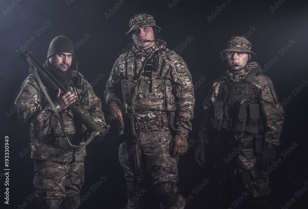 Fototapeta premium Elite squad soldiers with weapons and ammunition
