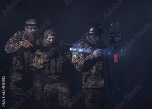 Elite squad soldiers with weapons and ammunition © Антон Фрунзе