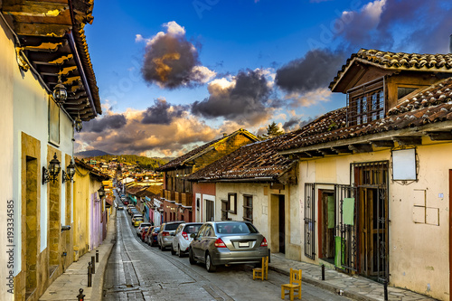 Mexico. San Cristobal de las Casas  (state of Chiapas). Spanish colonial style with narrow cobblestone streets and facades of the buildings painted in various colors photo