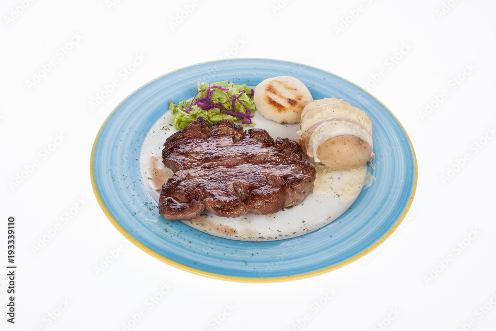 steak roast beef with steamed potatoes on white background steak roast beef with steamed potatoes on white background