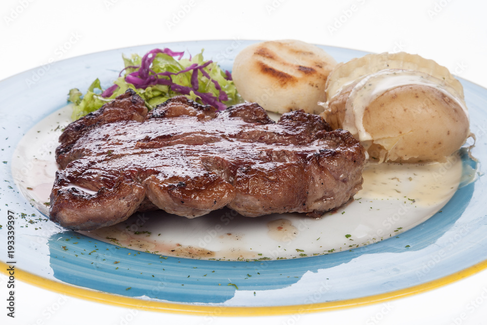 steak roast beef with steamed potatoes on white background steak roast beef with steamed potatoes on white background