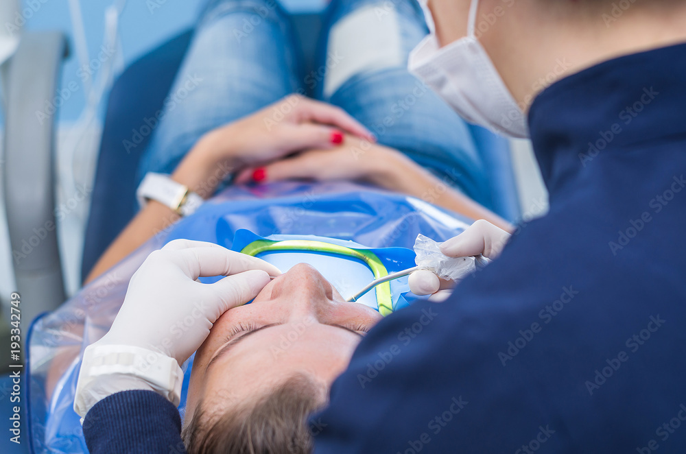 Great concept of dental procedure, young blond Brazilian woman in
