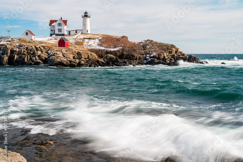 A wonderful lighthouse perched on an island in Maine.  photo