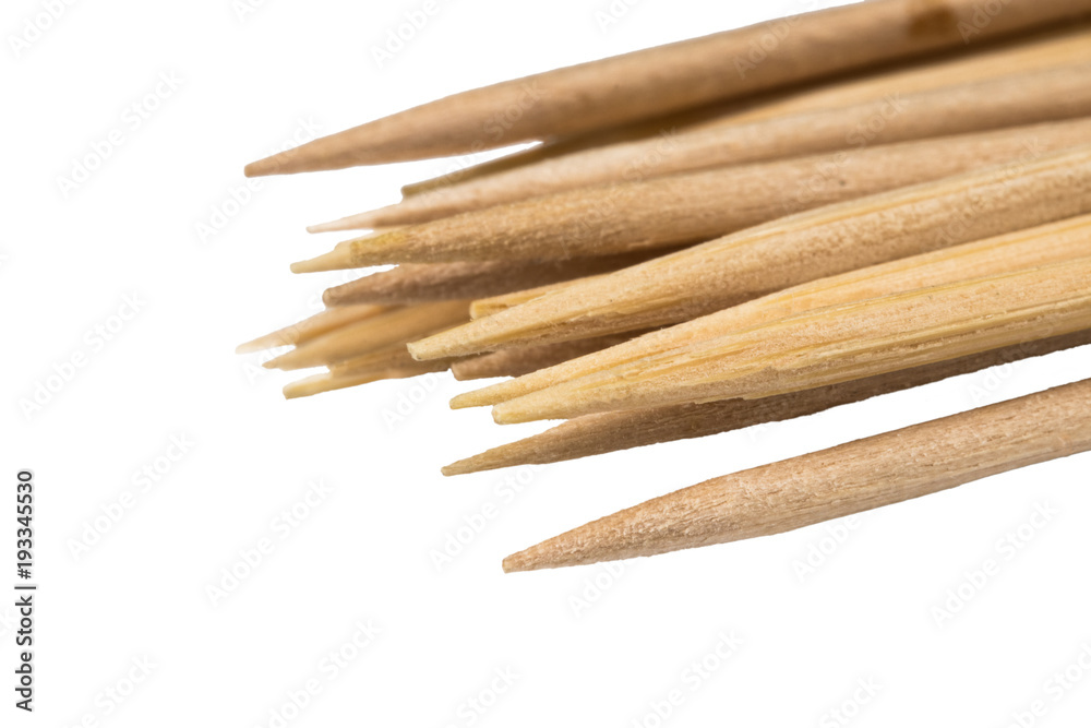 Bamboo wooden toothpicks on white background Close-up