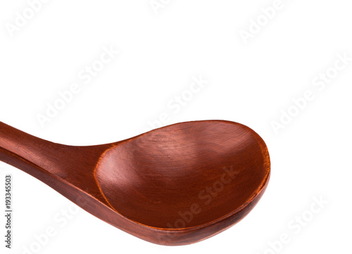 Wooden spoon isolated on white background. Close up photo