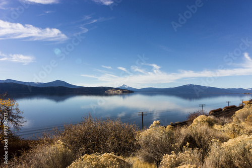Mount Mcloughlin in a range reflecting on a lake in Oregon.