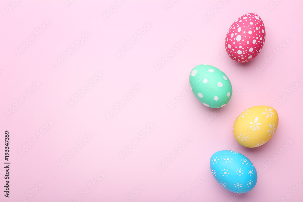 Colorful easter eggs on pink background