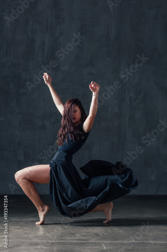 Young beautiful female dancer is posing in the studio © Alexander Y