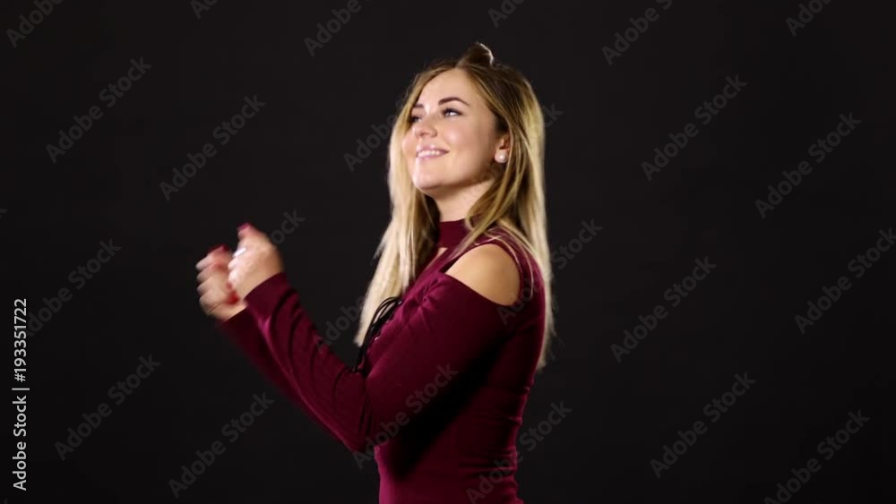 Pretty blond woman smiling and acting playful. Pretty blond woman smiling and acting playful.