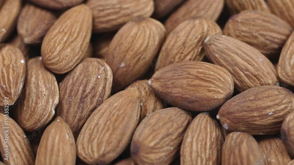 Almond closeup. Rotating nuts background Almond closeup. Rotating nuts background