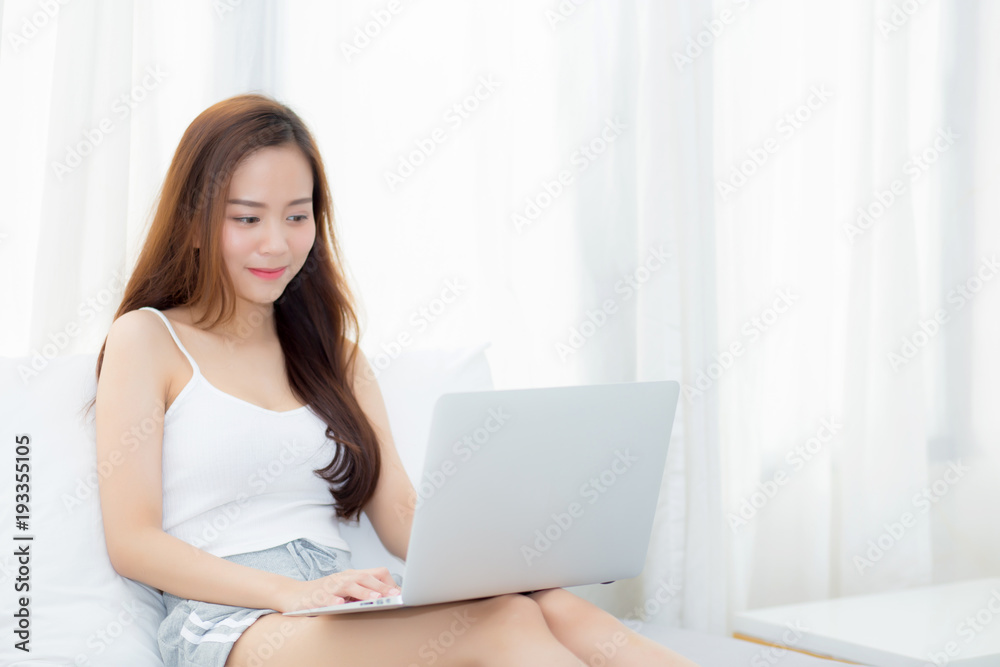 Beautiful young asian woman using laptop for leisure on bedroom, girl working online with notebook freelance, business concept. Beautiful young asian woman using laptop for leisure on bedroom, girl working online with notebook freelance, business concept.