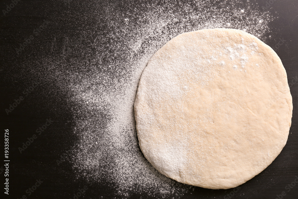 Raw dough on kitchen table Raw dough on kitchen table