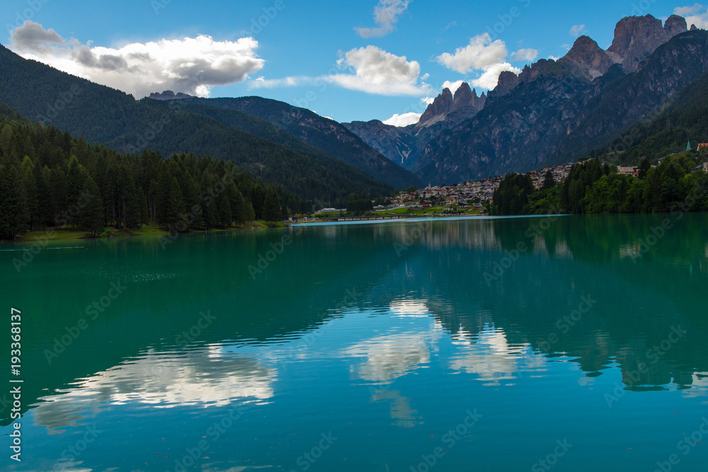 Panoramic view of the village of Auronzo di Cadore (Italy) from its lake, with the Dolomites (Tre Cime di Lavaredo mountain group in particular ) in the background