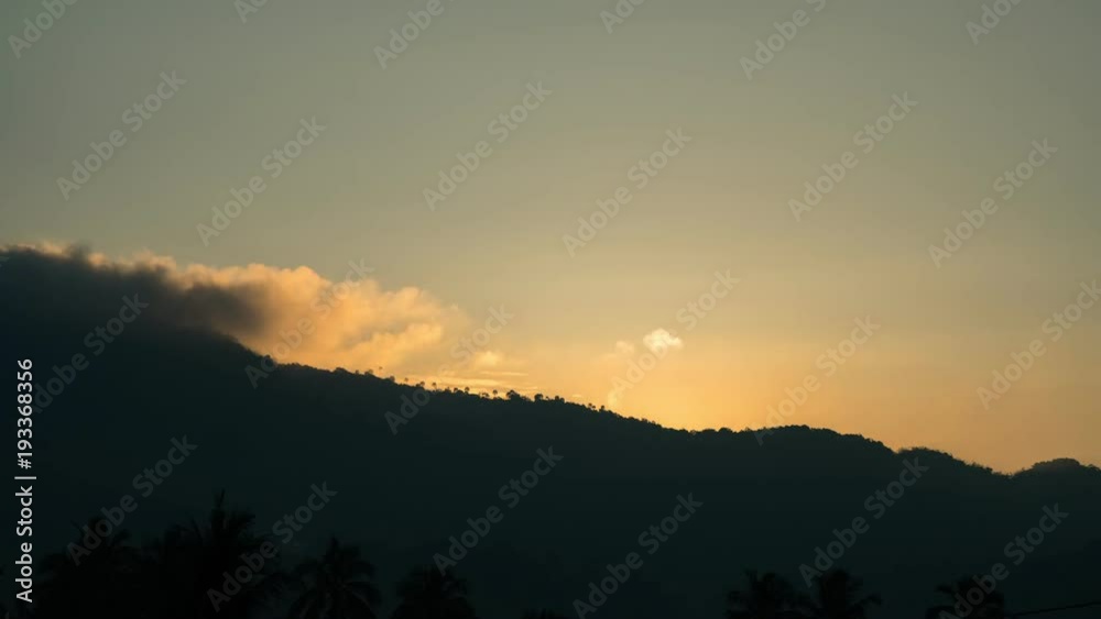 4K Timelapse of rolling clouds over mountain in sunrise or sunset time 4K Timelapse of rolling clouds over mountain in sunrise or sunset time