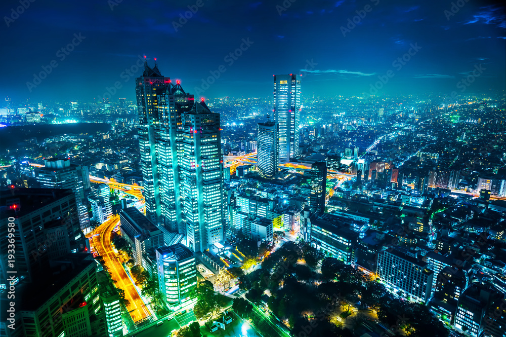 Fototapeta premium Asia Business concept for real estate and corporate construction - panoramic modern city skyline aerial night view of Shinjuku and Tokyo Metropolitan Expressway under twilight sky in Tokyo, Japan
