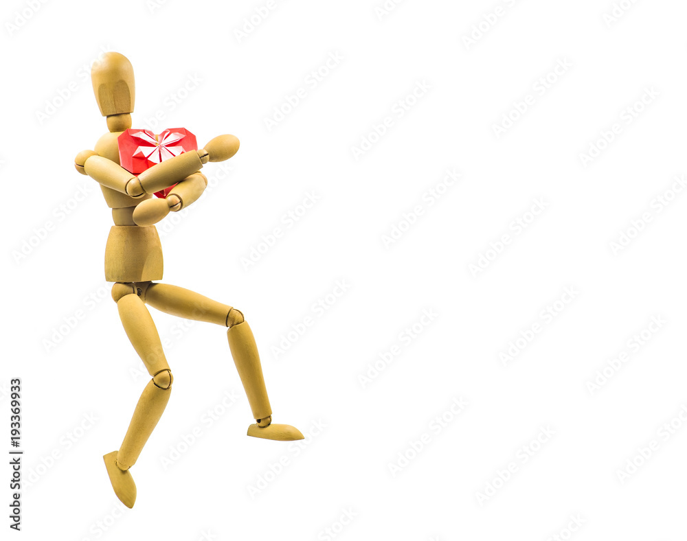 wooden puppet with red origami heart dancing isolated on white background