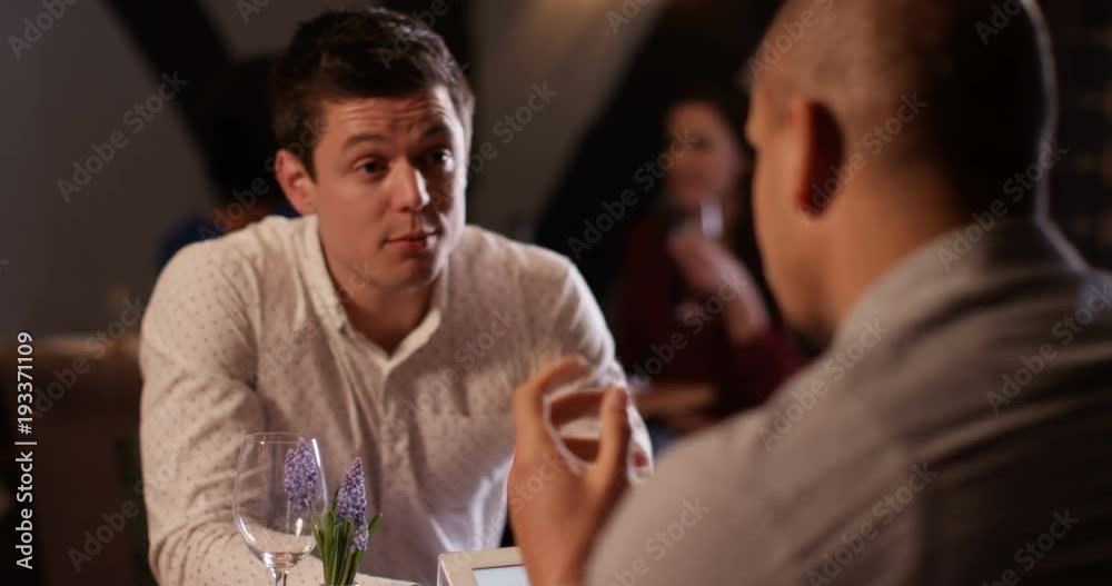 4k, Two business colleagues having a disagreement while having lunch at a restaurant. 4k, Two business colleagues having a disagreement while having lunch at a restaurant.
