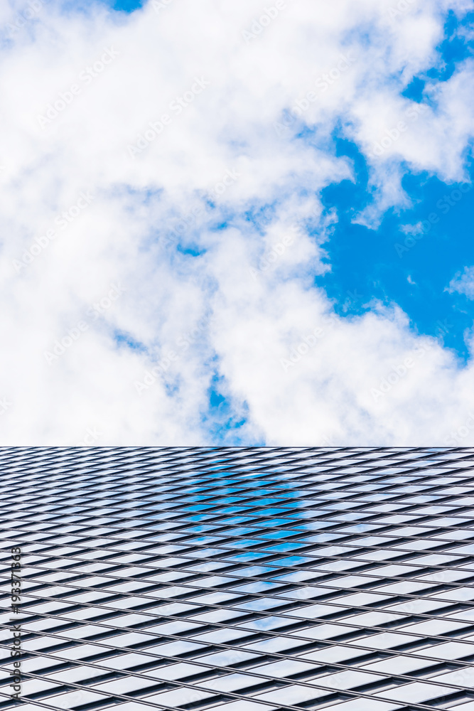Asia Business concept for real estate and corporate construction - looking up view in financial district, the silhouettes of skyscrapers reflect blue sky in Tokyo, Japan. Asia Business concept for real estate and corporate construction - looking up view in financial district, the silhouettes of skyscrapers reflect blue sky in Tokyo, Japan.