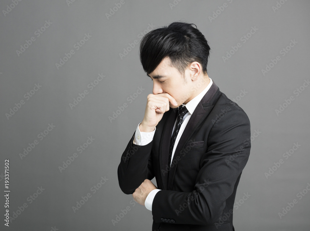 stressed Young business man with hand on head. stressed Young business man with hand on head.
