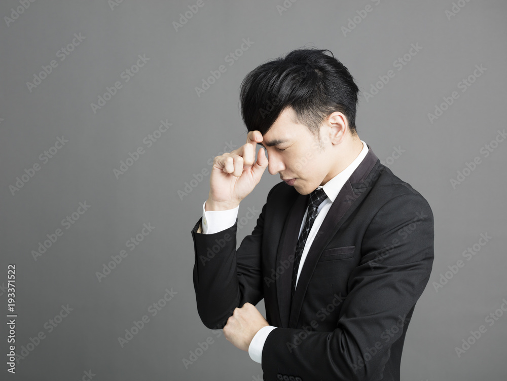stressed Young business man with hand on head stressed Young business man with hand on head