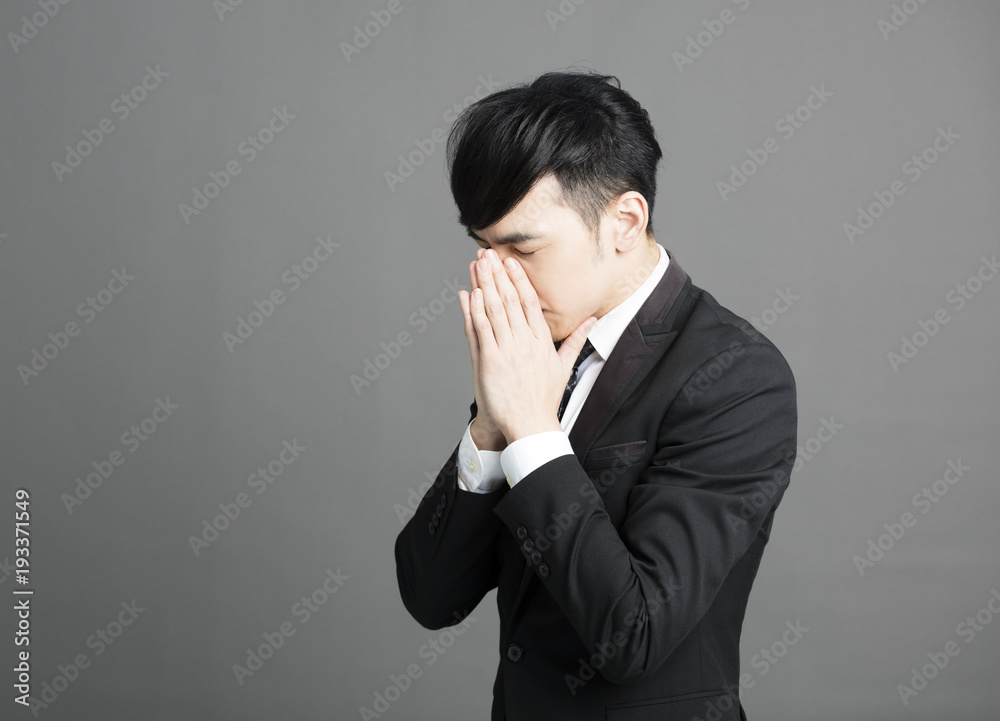 stressed Young business man with hand on head stressed Young business man with hand on head