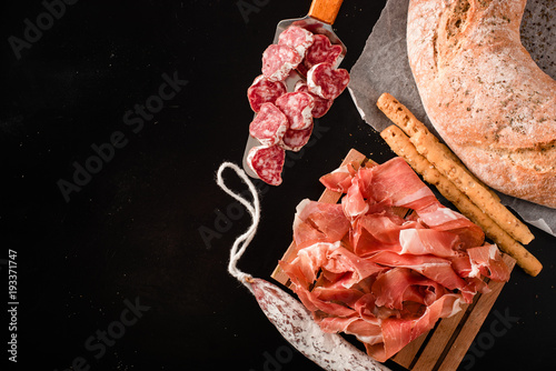 Traditional Galician white bread with moldy salami and jamon photo