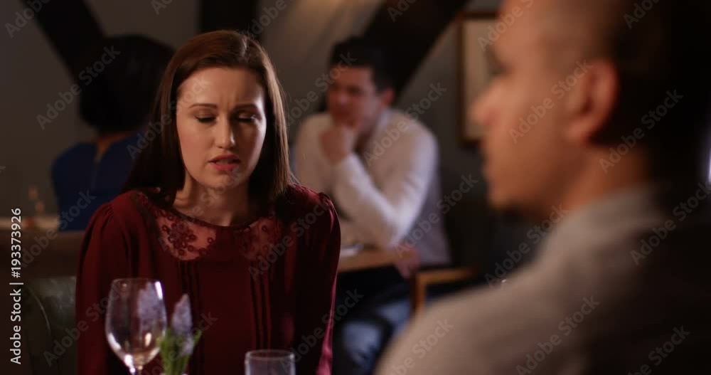 4k, A disagreeing couple having a heated argument while on date at a restaurant. Slow motion. 4k, A disagreeing couple having a heated argument while on date at a restaurant. Slow motion.