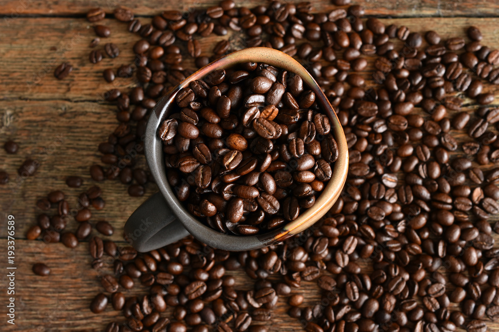 Roasted Coffee Beans in a Brown Ceramic Coffee Mug