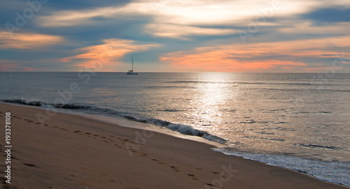 Sunrise over beach and charter fishing boat in San Jose Del Cabo in Baja California Mexico BCS