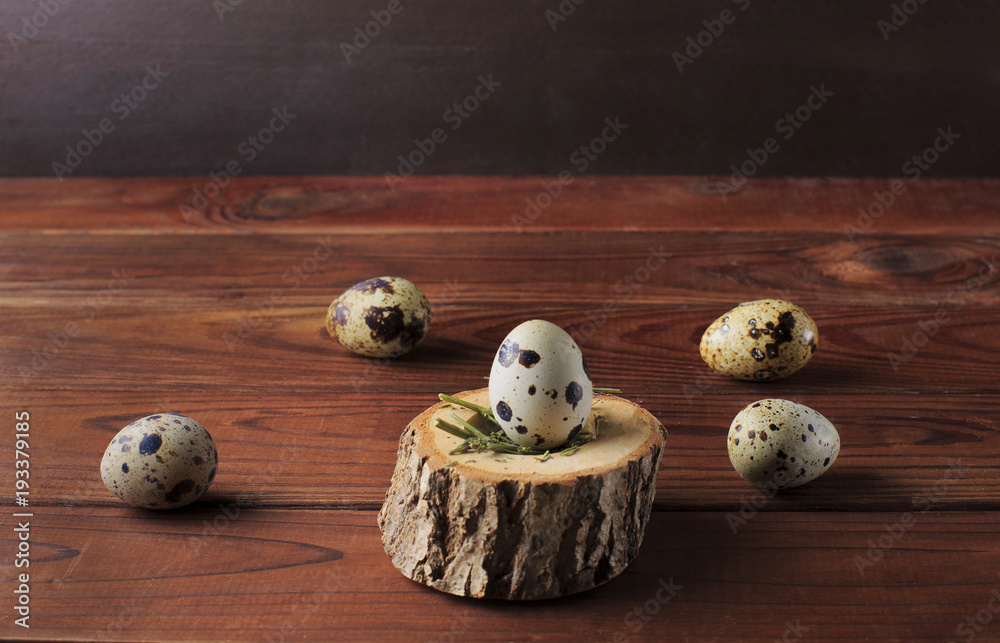 Quail eggs on the brown wooden table background. Easter table. Copy space. Quail eggs on the brown wooden table background. Easter table. Copy space.