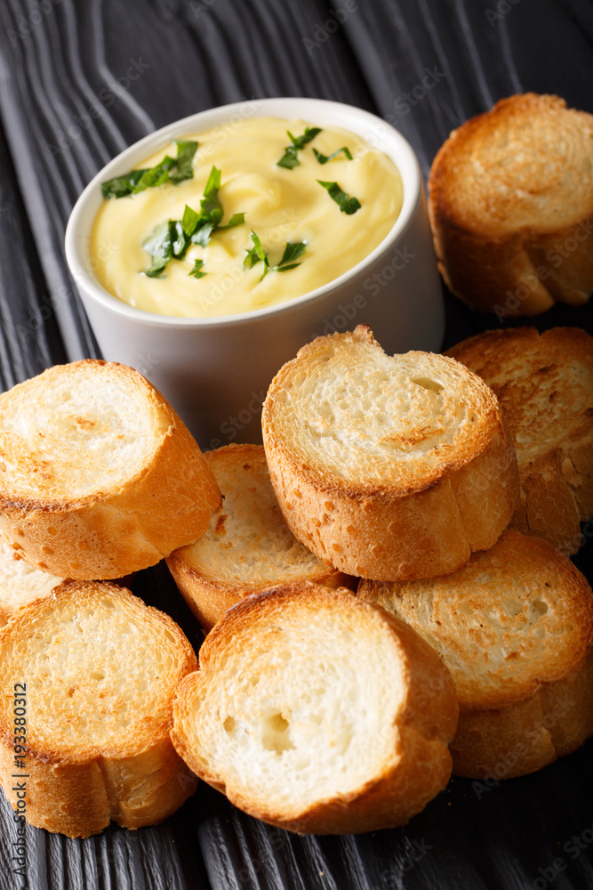 Homemade toasted bread and cheese sauce close-up. vertical