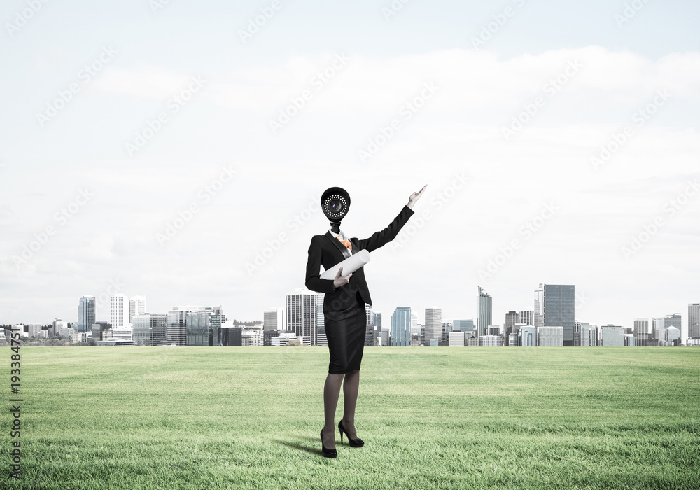 Camera headed woman standing on green grass against modern citys Camera headed woman standing on green grass against modern citys
